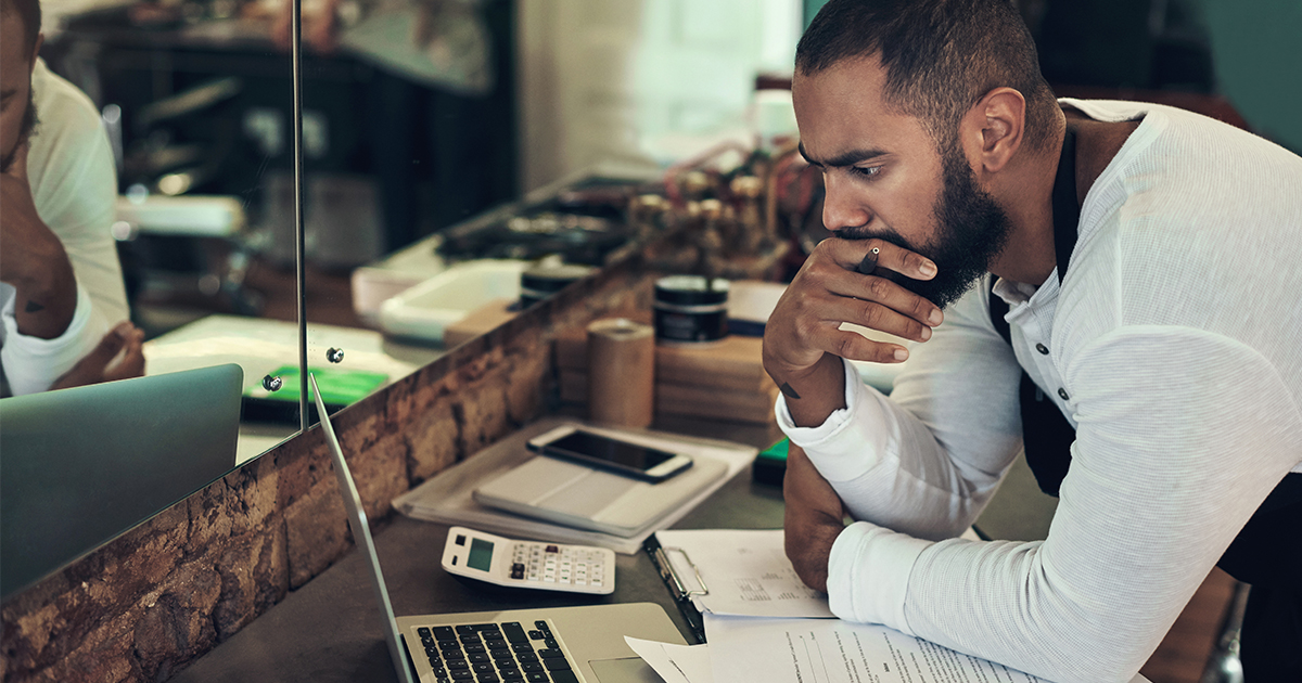 business owner looking at computer