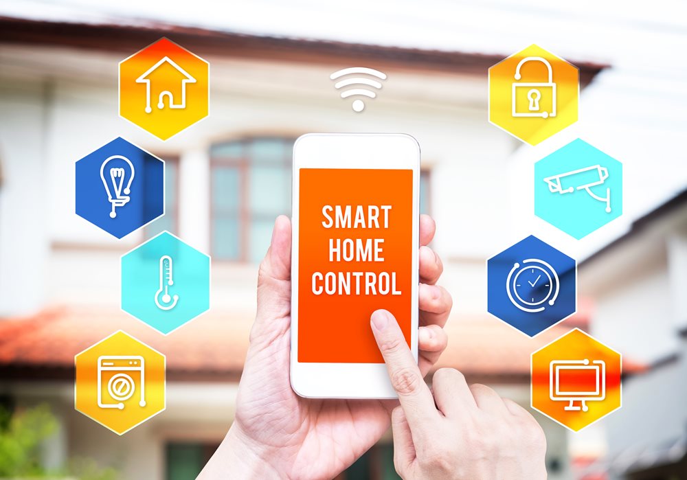 Hand holding smart phone with home control application with blur 