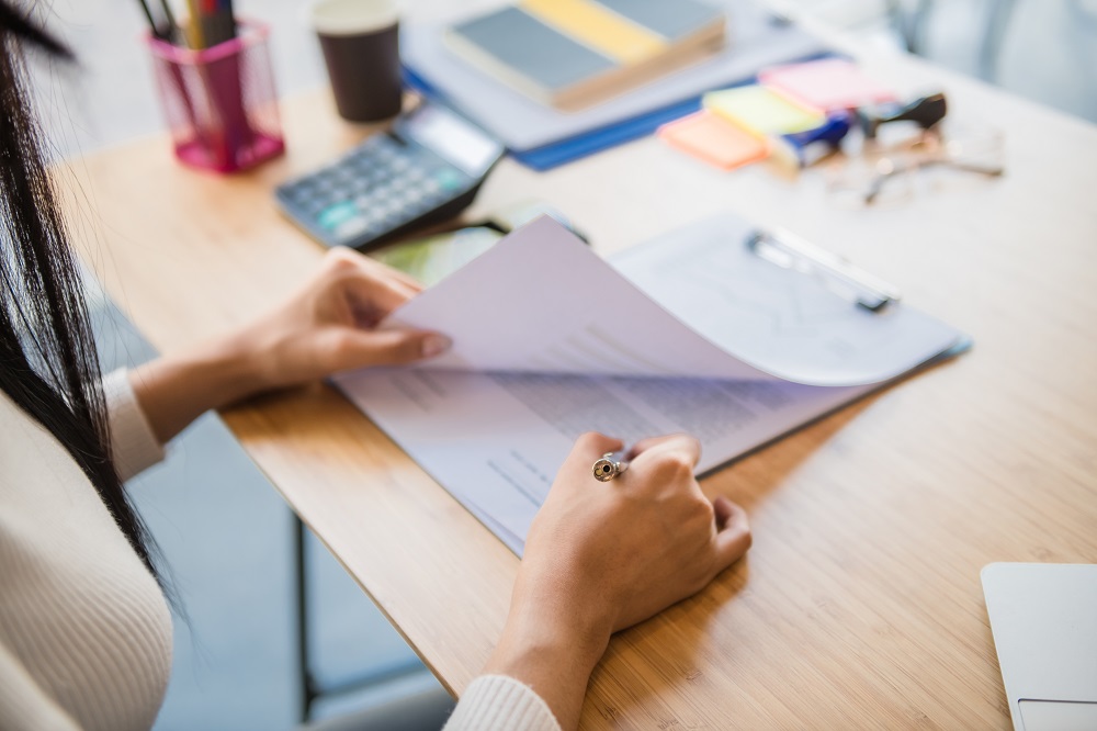 person looking at mortgage paperwork