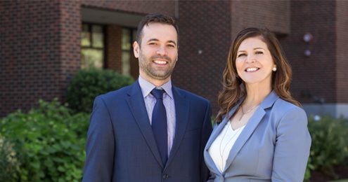 Branch Managers Ismael Tavares and Fran Oliveira Standing Together