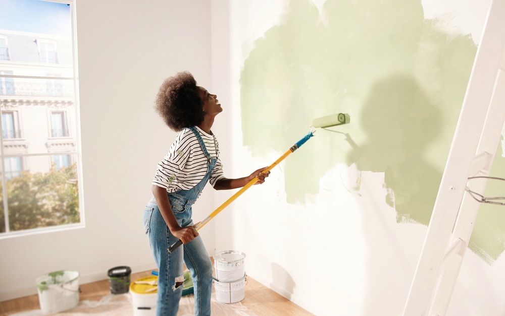 woman painting a wall